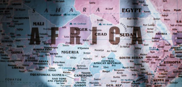 Closeup of map of Africa with countries borders and water on sunny day